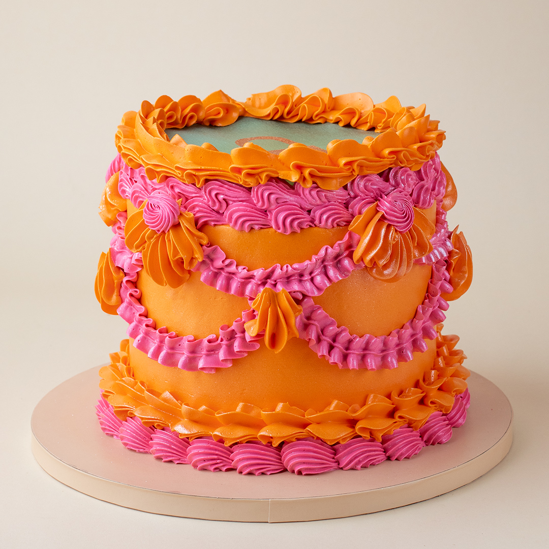 Taylor Swift Showgirl Pink and Orange Vintage Burnaway Cake - Bob the ...